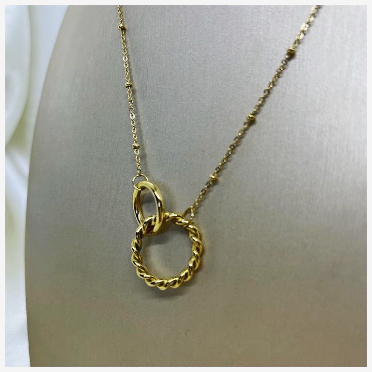 Collier double anneaux torsadé